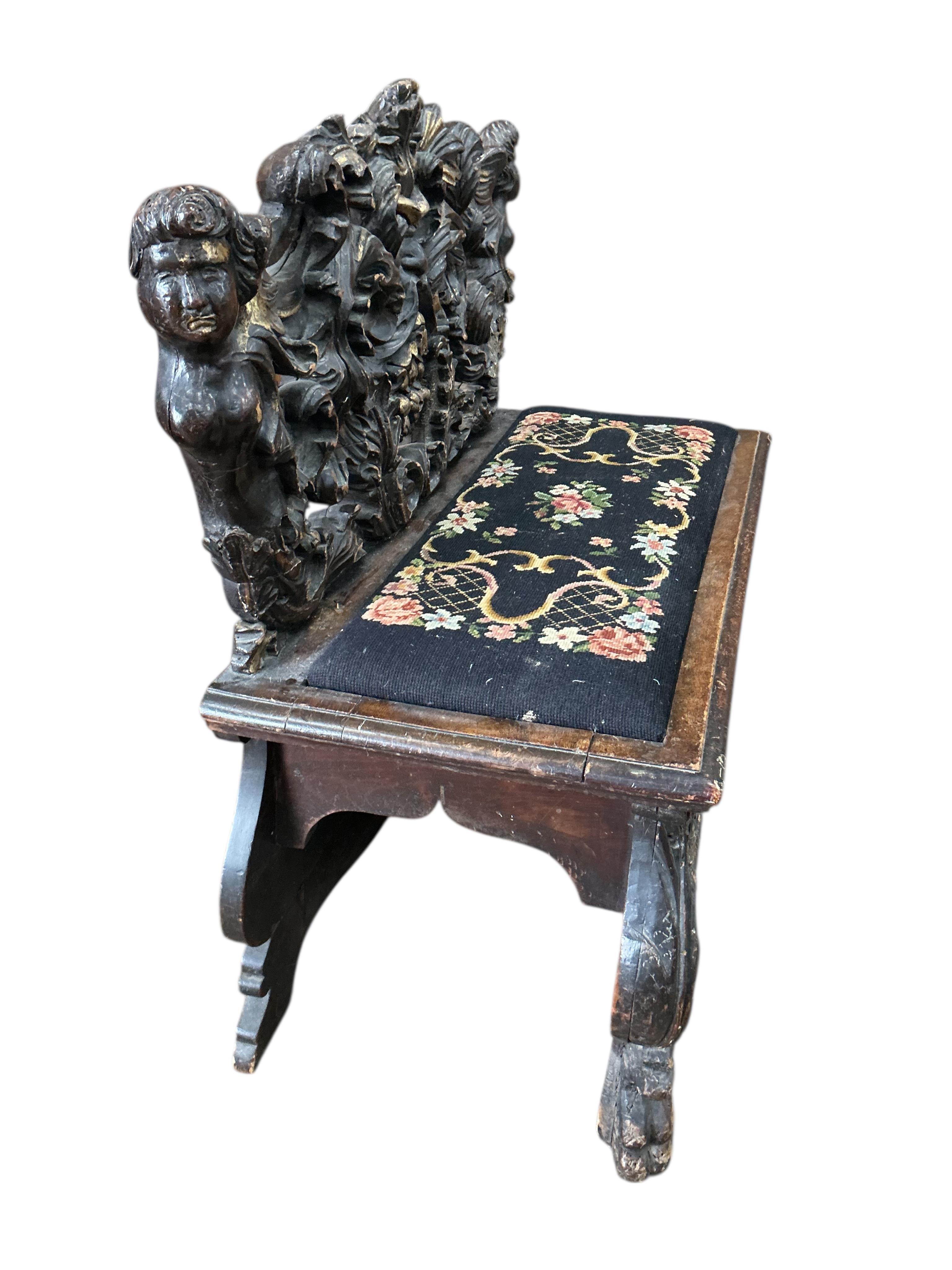 A 19th century Italian giltwood and later painted carved bench, width 95cm, depth 46cm, height 92cm